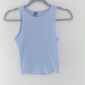 Light blue tank top that’s short but not cropped.